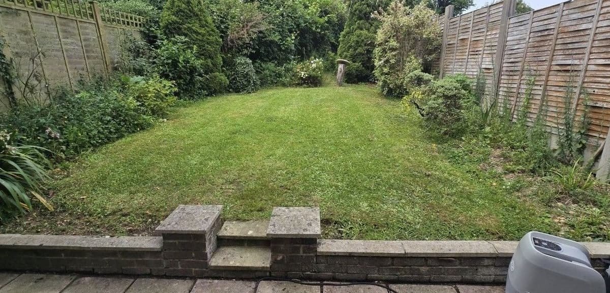 Holiday let garden lawn mown and edged ready for guests