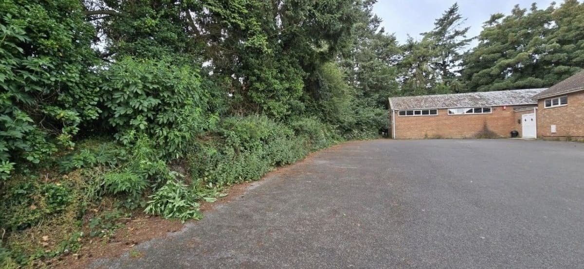 Before: car park bank cut back in Lymington